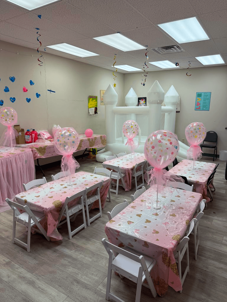 Birthday table with the gift centered and every chair placed just so.
